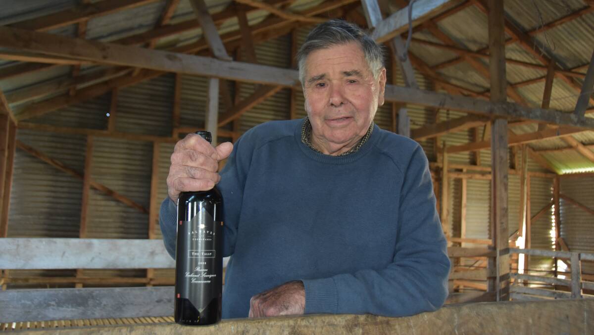 Doug Balnaves with a bottle of the familys top drop, the Tally Reserve Cabernet Sauvignon, which is a nod to his early years as a shearer.