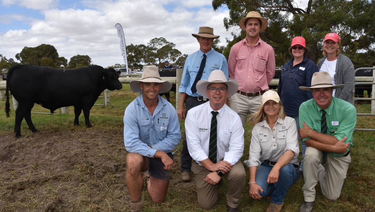 Pathfinder's Nick Moyle, Elders Naracoorte livestock manager Josh Reeves and client Julie Wyatt, Mount Kincaird, Portland, Vic, who bought the $34,000 sale topper, Sara Moyle and kneeling are Gazette manager Darcy Lewis, Nutrien's Gordon Wood, Elle Moyle and Nutrien's Richard Miller.