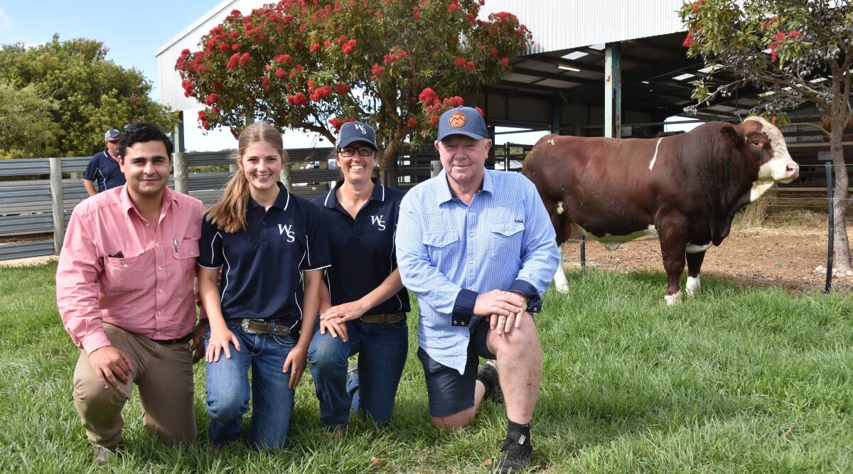 Elders stud stock's Ryan Bajada and John Leek, Mt Ararat Simmentals Nar Nar Goon, Vic, bought charity lot, Woonallee Raffa. They are pictured with Lizzy and Olivia Baker.