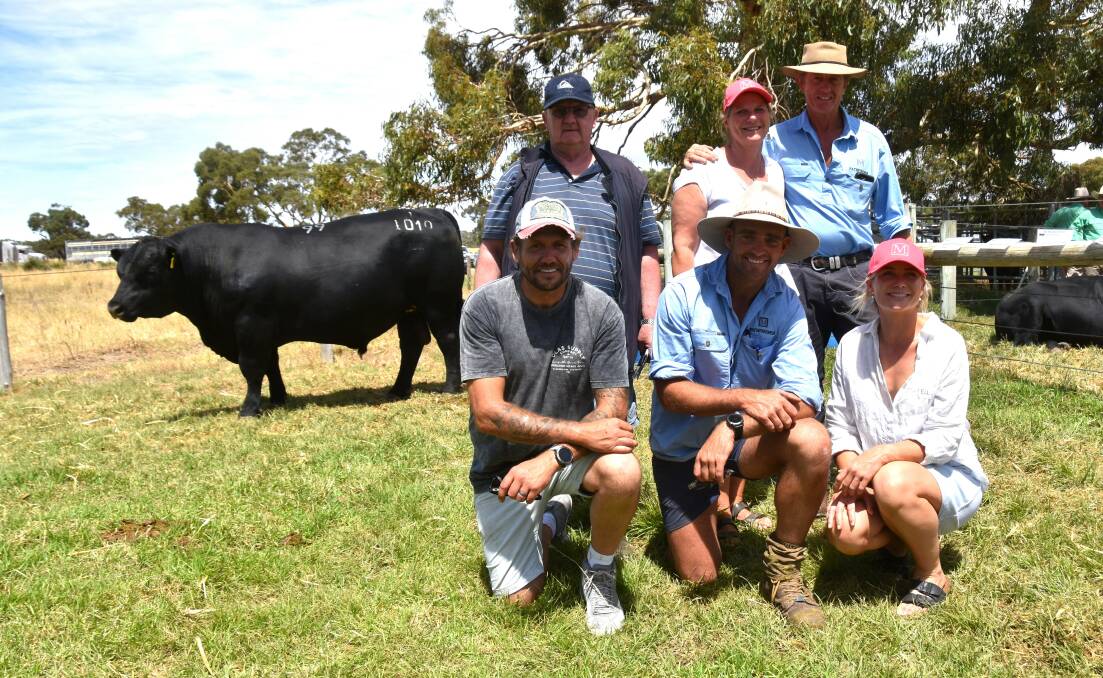 David and Josh Harvey, King Island, paid the $30,000 top price. They are with Pathfinder stud's Sara and Nick Moyle and kneeling Gazette manager Darcy Lewis and Elle Moyle. Pictures by Catherine Miller