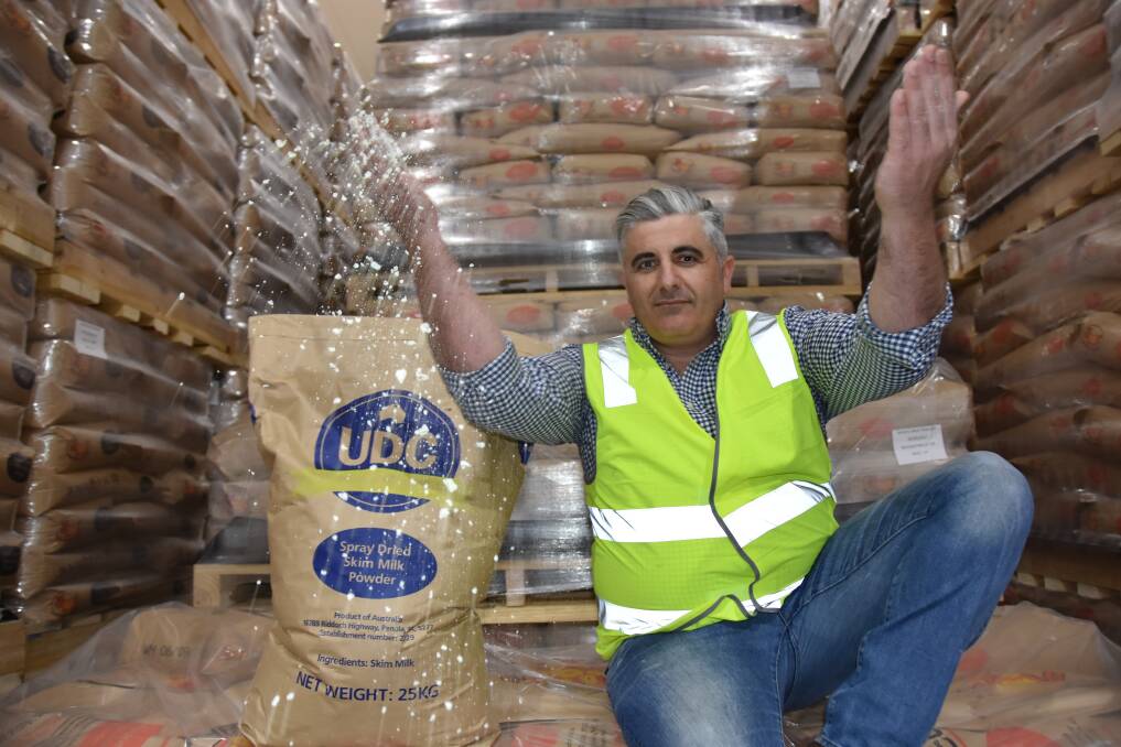 RACING AHEAD: Midfield dairy operations director Daniel Aarons with some of their United Dairy Company milk powder in the Penola warehouse.