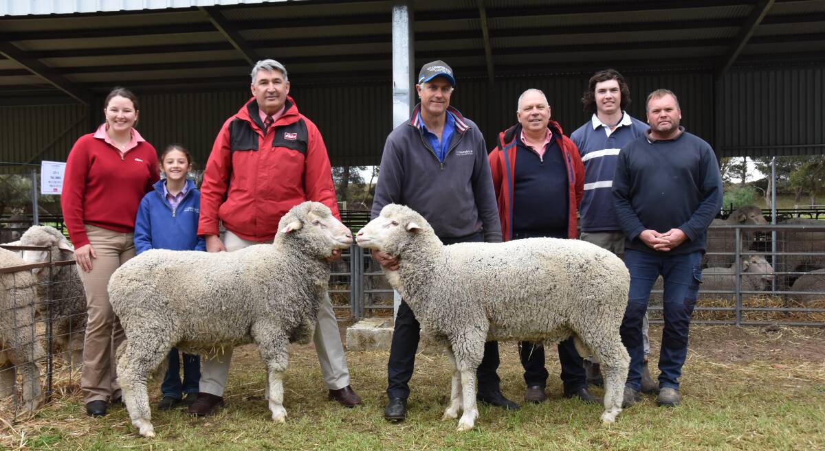 DOUBLE HIGH: Lucy Meyer, Lottie Cooper, Laryn Gogel, Seth Cooper, Trevor Smith, Lachie and Damian Jacobs, Coonalpyn, with the two $3200 top priced rams.