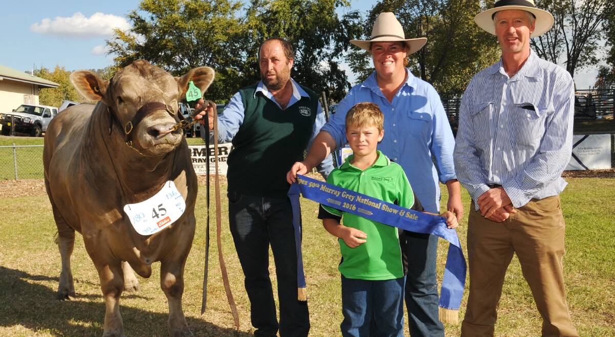 SALE HIGH: Geoff, Kate and Sam Buick, Arki stud, Western Flat, with their $12,000 top price bull and buyer Paul Francis, Ondiong stud, NSW.
