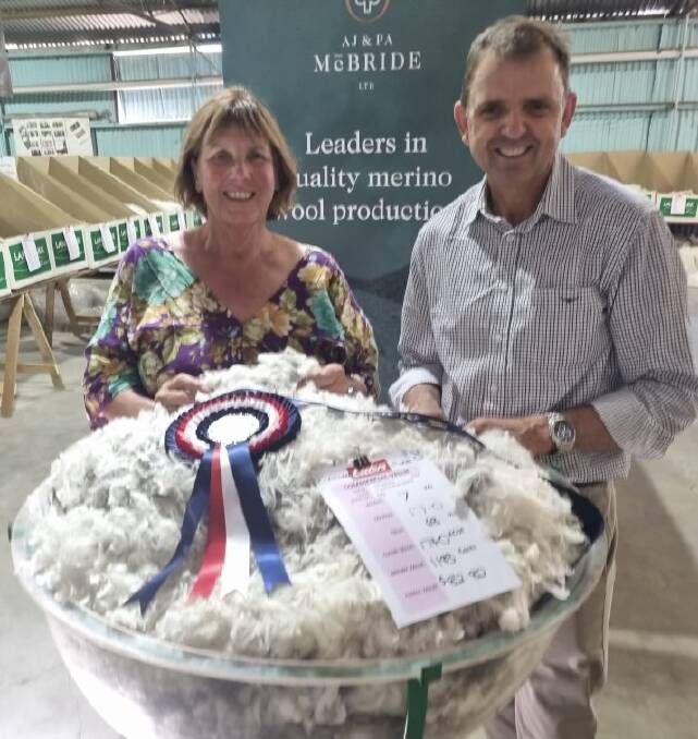 Judge and Elders district wool manager Steph Brooker-Jones with Nick McBride, Conmurra Station, Conmurra with his champion fleece from a yellow tag Merino ewe. Picture supplied. 