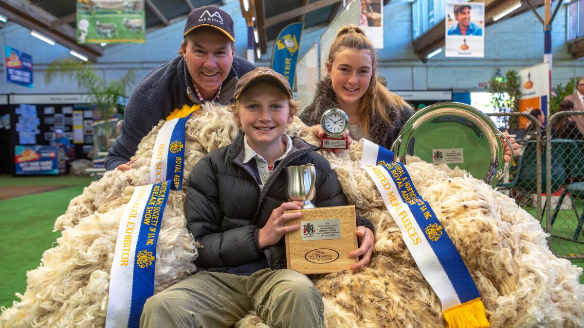 MOST SUCCESSFUL: North Ashrose stud's Matt Ashby, son Dougal and daughter Emily, Gulnare, were the most successful Merino wool exhibitor. Their 11 fleeces won six classes, including the best group of three ewe fleeces.
