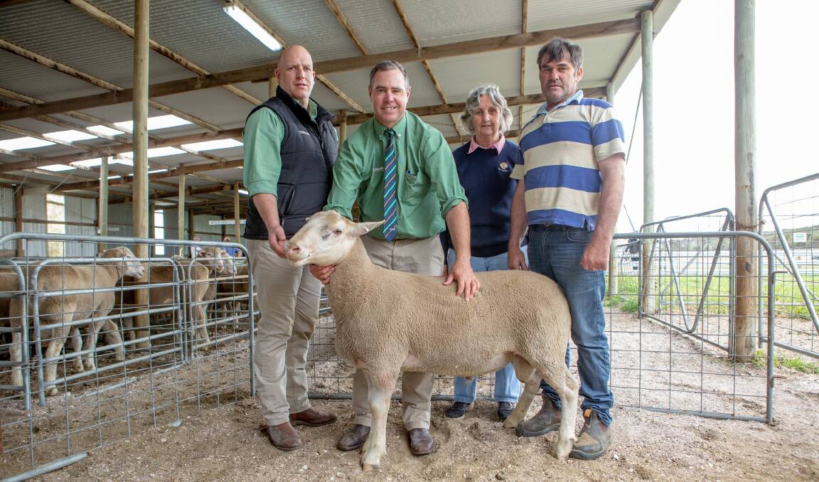 PICK WHITE: Landmark's Anthony Driessen and Richard Miller, Mary Burzacott and buyer of the $2300 ram Kevin Smith, Eight Mile Creek.