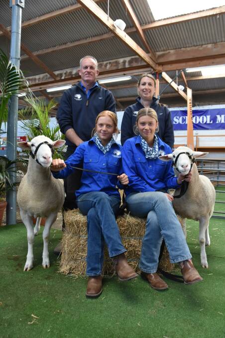 Lucindale Area School students Harmony Reed and Stella Roach with staff Brad Sheather and Carol Hille and their two White Suffolk rams which they showed at gthe Royal Adelaide Show. Picture by Catherine Miller
