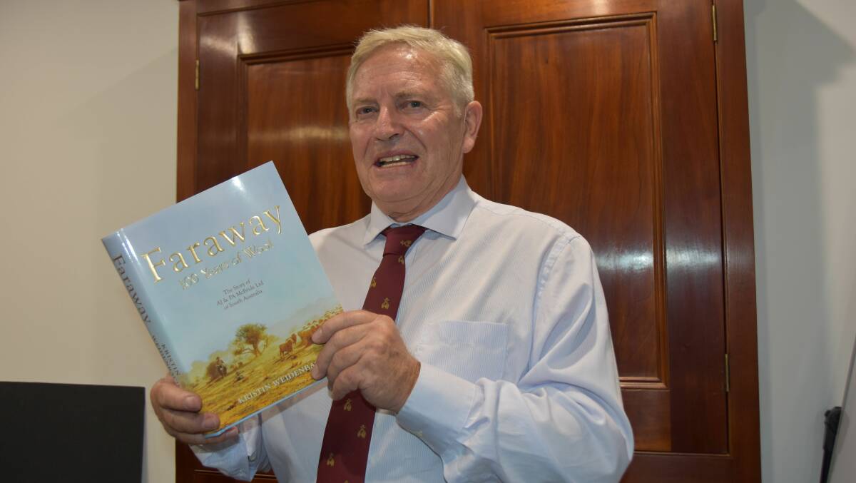HISTORY TOLD: Jim McBride with the book Faraway: 100 years of wool which has been a labour of love for him over the past three and a half years.