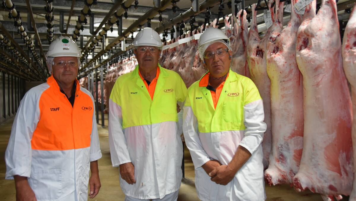 HOOK TRIAL: JBS Bordertown manager Trevor Schiller with Mundulla Prime Lamb Competition organisers Francis Andrews and Tim Wiese in the plant where the more than 450 lambs will be processed.