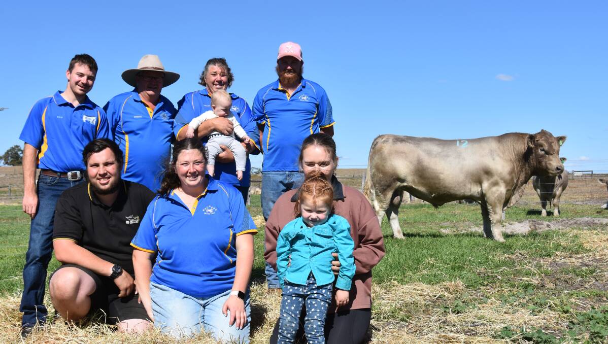 Ethan, Anthony, Denise Fabris holding grandaughter Remi, Liam Fabris and (kneeling) Mitchell Sims, Courtney Fabris and Billie and Giovanna Fabris with the highest priced Beeamma bull, lot 12. Picture by Catherine Miller