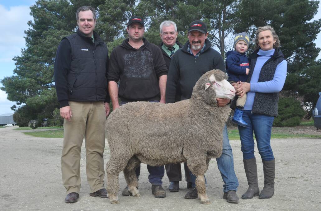 SALE TOPPER: Landmark's Richard Miller and Leo Redden (third from left) with buyer Brent Farr, Loxton and David and Karen Ridgway and grandson Hudson.