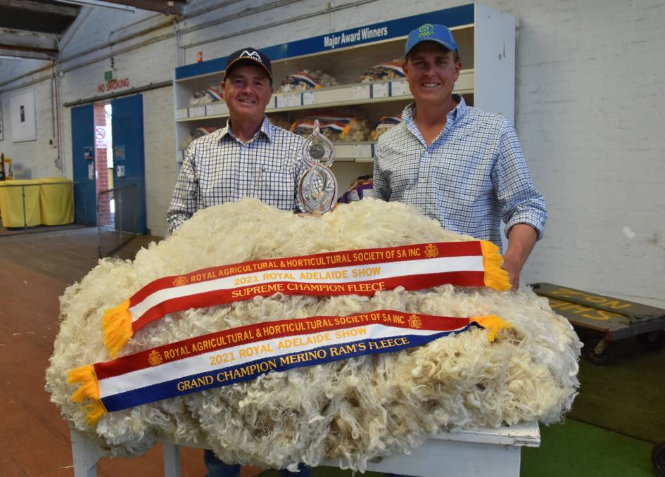 SUPREME SUCCESS: Tom and Angus Ashby, North Ashrose stud, Gulnare, with their supreme champion fleece which was shorn off one of their stud reserve rams.