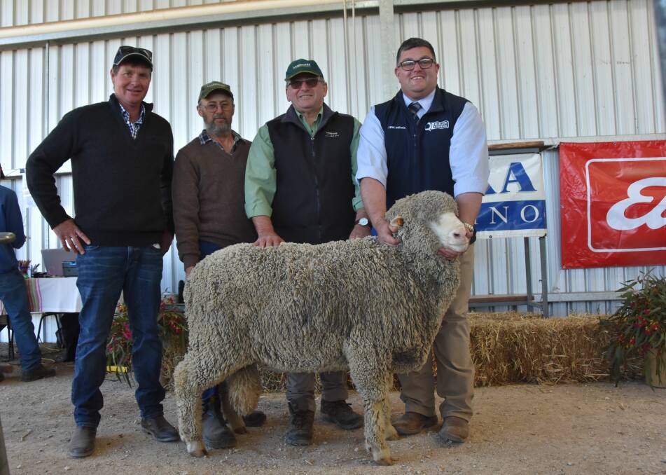 Kiandra stud principal Ryan Kluska with the buyer of the $5200 top price ram Andrew Terry and his agent Landmark's Peter Hollenberg and Quality Livestock's David Whittenbury.