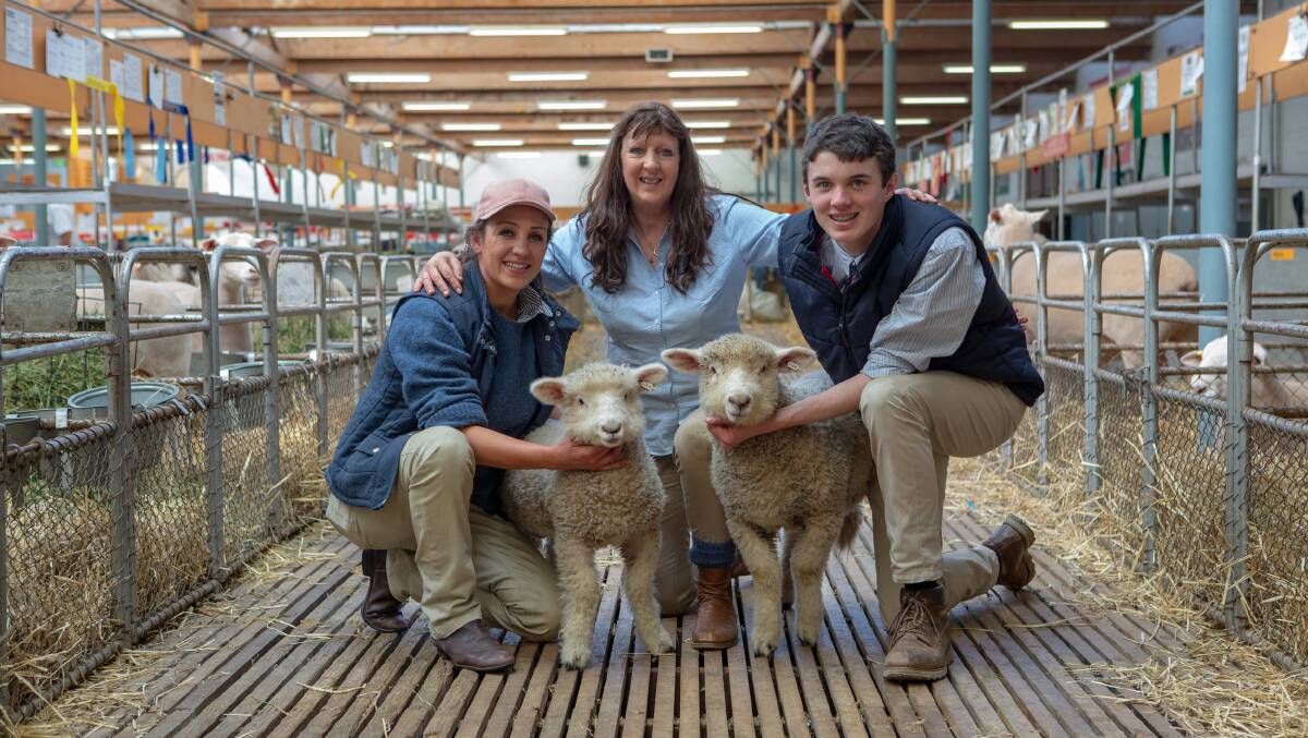 FAMILY TRADITION: Leslie Brewer (centre) and children Dusty Jones and Beau Gemmell with some of their Romney lambs at the Royal Adelaide Show last week. 