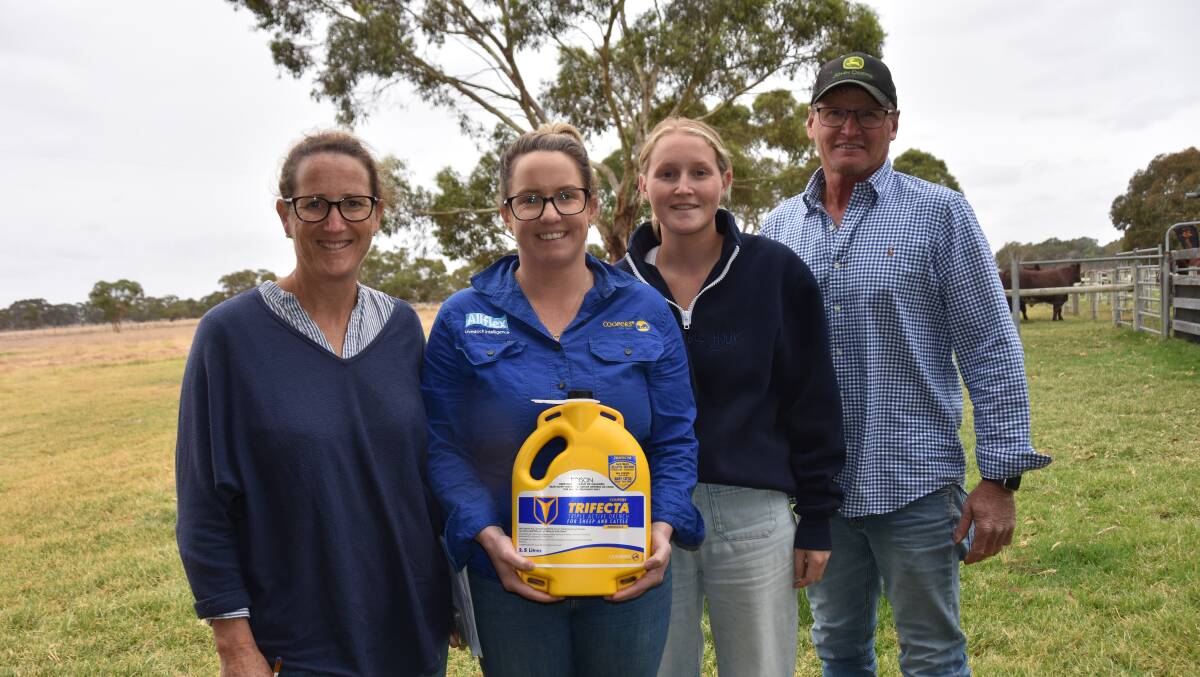Coopers Animal Health territory sales manager Stacey Lehmann (second from left) presents a volume buyer prize to Jane, Emillie and Richard Gould, Cortina Pastoral, Lucindale. They bought two bulls at $14,000 each.