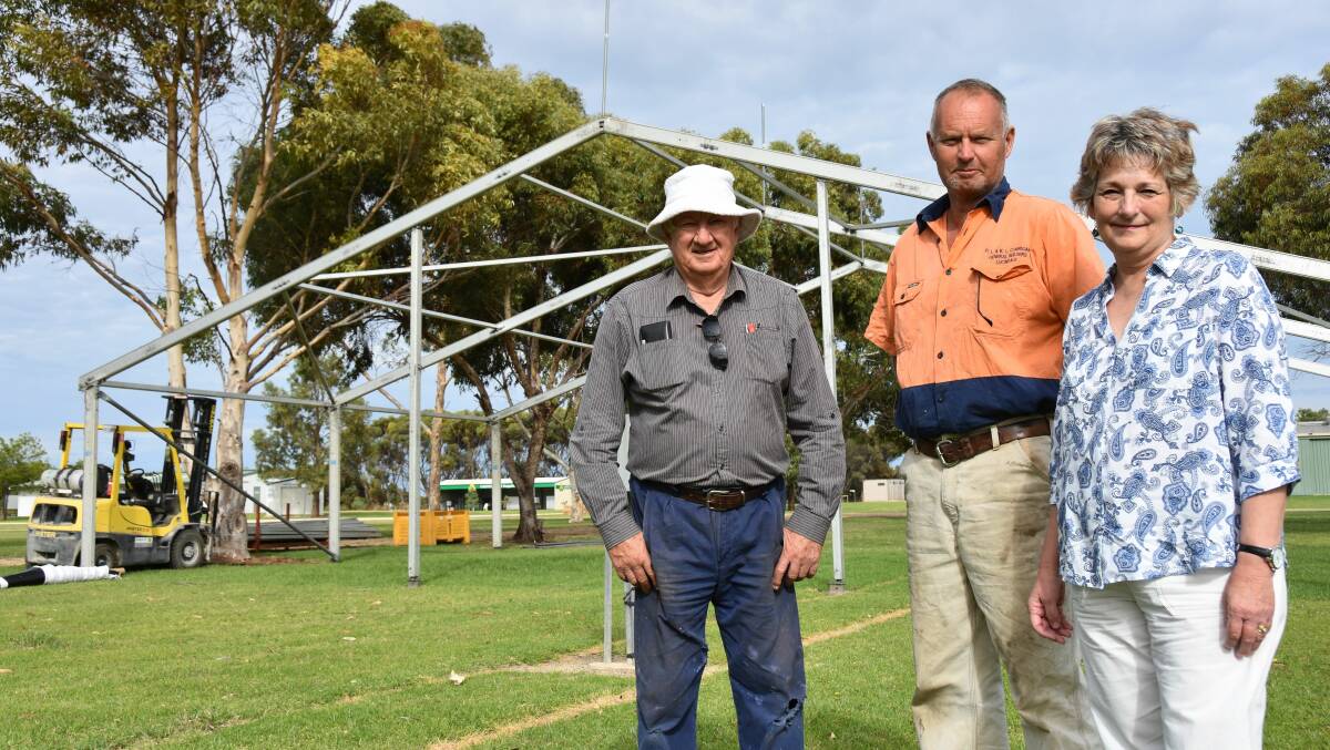 South East Field Days chairman Trevor Martin, Lucindale Lions Club president Peter Corrigan and SEFD secretary Lyn Crosby in 2020 at Yakka Park where marquees were being dismantled as the field days was called off just days before the event.