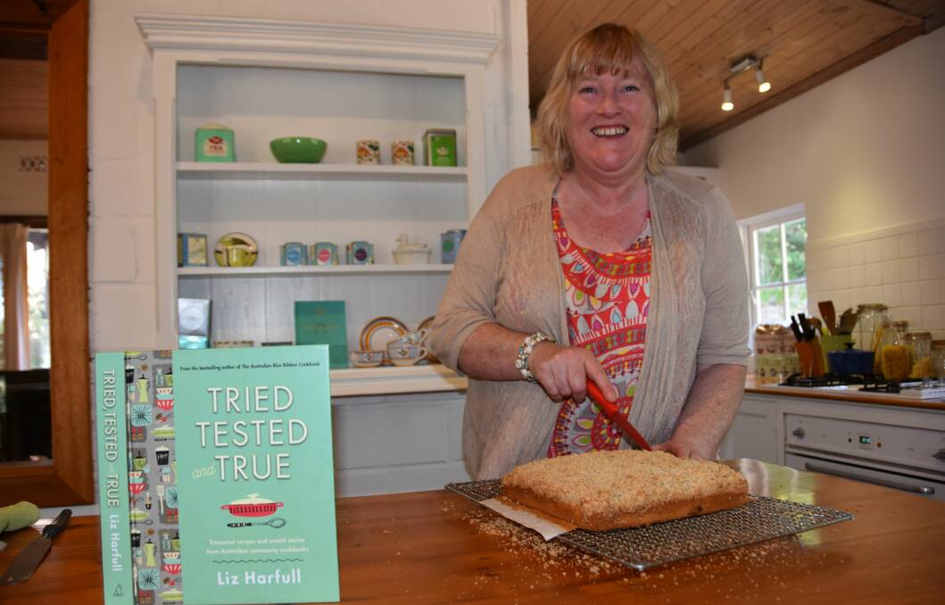 RECIPE FOR SUCCESS: Author Liz Harfull with a beer cake, one of the recipes featured in her new cookbook. It came from the Up the Track: Guide Dog Cookbook from Pat Morton of Victory Downs Station, on the SA-NT border.