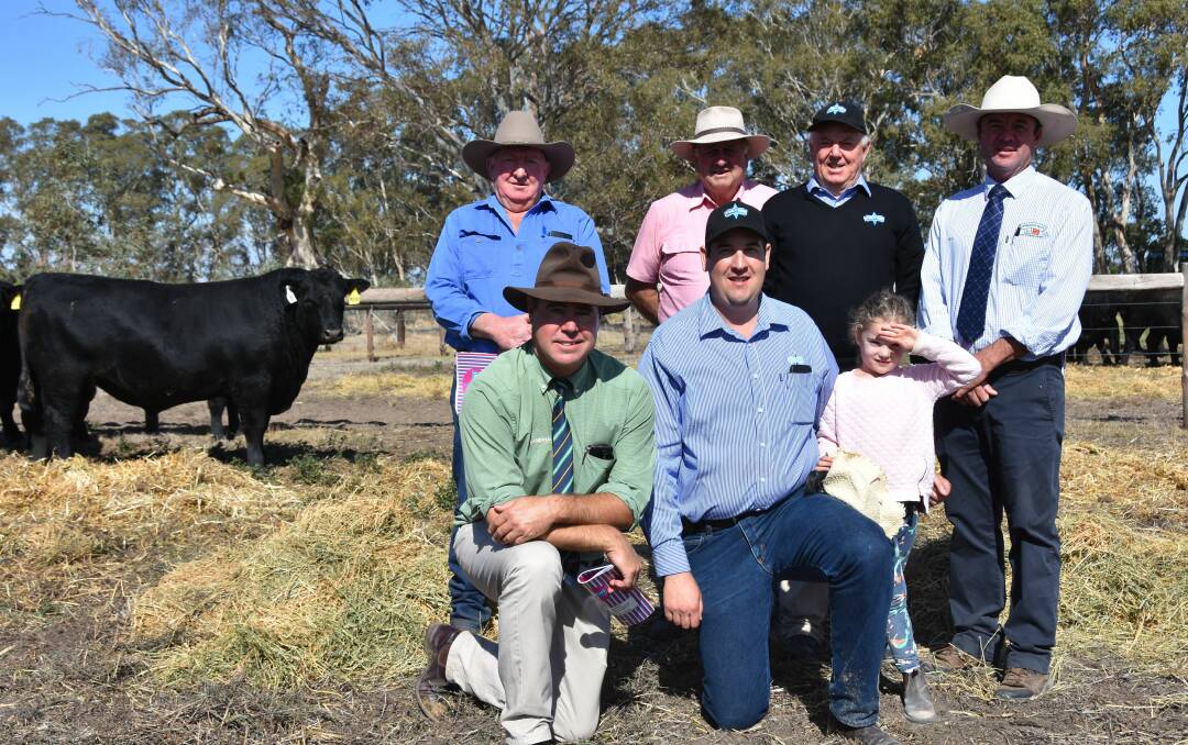 SALE HIGH: Pat Geraghty, Mount Schank and agent Elders Mount Gambier's David Creek paid the $8000 top price at Stoney Point's Ready to Work Bull Sale. They are with stud director Perry Gunner, Spence Dix & Co's Jono Spence and (kneeling) Landmark's Richard Miller, Stoney Point manager Peter Collver and Perry Gunner's granddaughter Audrey Hay.