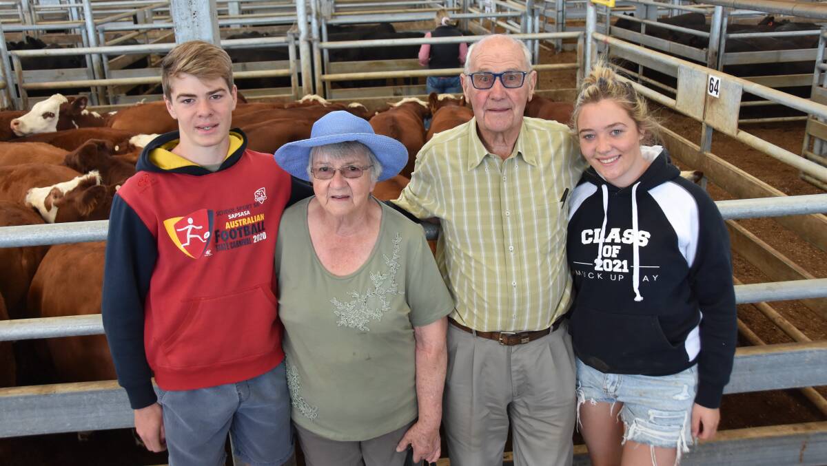 Long time weaner sellers Wendy and David Lawrie. Bloomfield, Lochaber, pictured with grandchildren Aaron and Sarah Dally, Mount Gambier, had some well-bred Simmental-Hereford heifers. Their 57 heifers topped at $1610.