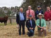 Belmore stud principal Andy Withers, Elders Naracoorte agent Alan Thomson, Belmore's Ali Volker, Elders stud stock auctioneer Tony Wetherall and kneeling Belmore's Lottie Volker and Nutrien stud stock manager Gordon Wood with the lot 1 sale topper which sold for $20,000.