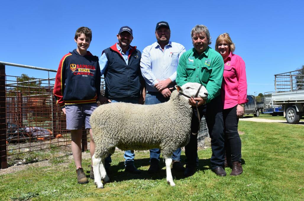 PAXTON PURCHASE: Will and Martin Harvey, Paxton stud, Western Flat, paid $15,000 for the top price ram at Johnos sale, with SAL's Mat MacDonald and vendors Jeff and Raelene Johnson.