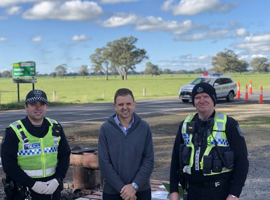 ENTRY POINT: Member for MacKillop Nick McBride (centre), with senior constables Michael Krawczyk and Tim Peecock at the Hynam checkpoint last year. File photo