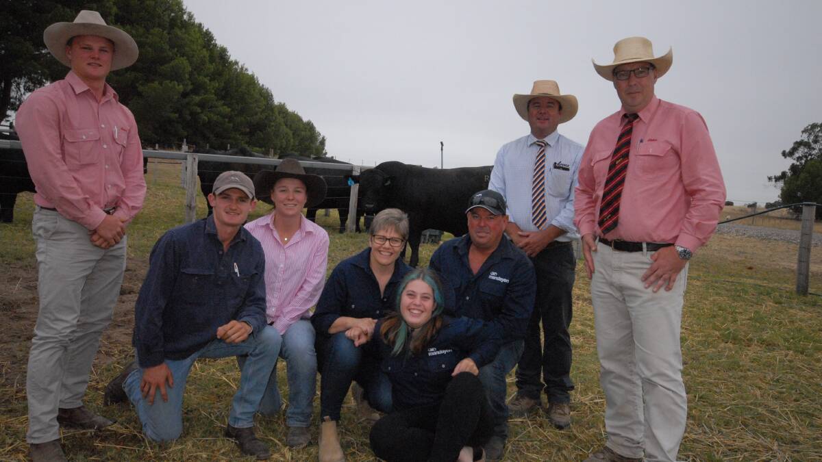 Buyers of Mandayen Angus stud's $40,000 sale topper, Nathan, Anthony and Alex McCarthy with Mandayen stud's Mandy, Zoe and Damian Gommers, Spence Dix & Co's Jono Spence and Elders' Ross Milne.