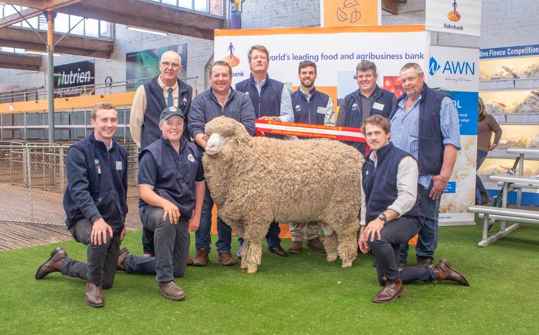 Judges Cody Jones, Gary Kopp, Nathan Teakle, Rick Wise, Jeremy King, Luke Saegenschnitter and Justin Mills with a proud Darcy Meyer (kneeling) and Paul Meyer, Mulloorie stud, Brinkworth, holding their supreme exhibit. Picture by Jacqui Bateman.