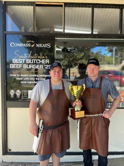 Compass Meats owner and butcher Derek De Kruyf and butcher Will Draper with the trophy they won for the nation's best butcher beef burger. Picture supplied.