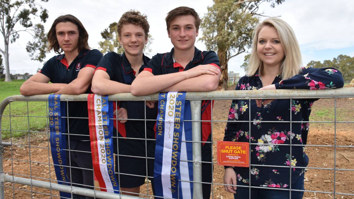 EYE FOR QUALITY: Naracoorte High School students Jake Shepherd, Ben Frick and Angus McKenzie who won the Limousin steer which went on to be the grand champion in Steer Showdown with agriculture teacher Emma Phillips.