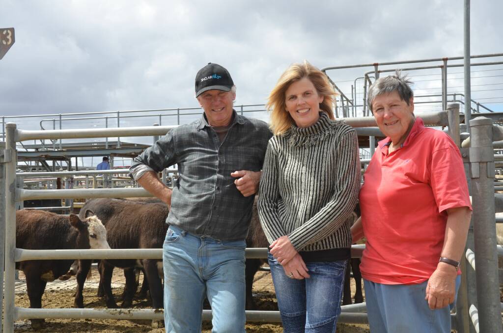 HAPPY VENDORS: Terry Steed and his partner Jane, Strathalbyn, at Strathalbyn store sale last week with a pen of their heifers and buyer Maureen Noske, Woodside. Terry said he had "never seen" prices as high in his nearly 30 years selling at the market.
