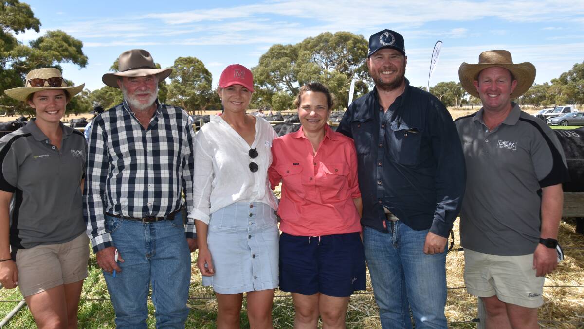Creek Livestock's Lauren Harvey and Scott Creek (right) with Elle Moyle and Peter, Diana and Geordie Tait, Retreat, Casterton, Vic, who bought four bulls to $20,000 twice. 