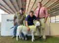 Anna Villa stud's Anthony Ferguson paid the $1500 top price for this UltraWhite ewe being held by Bundara Downs' Greg Funke. Also pictured is Elders auctioneer Laryn Gogel. Picture supplied