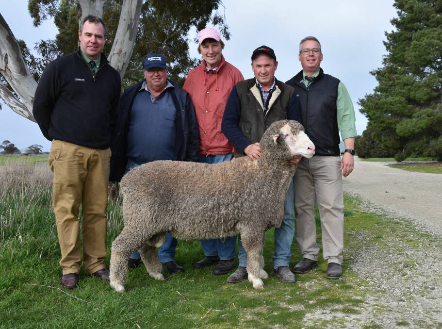 TOP BUY: Landmark auctioneers Richard Miller and Gordon Wood (right) with top price buyers,Geoff and Sue Zacher, Coonalpyn, and stud principal David Ridgway.