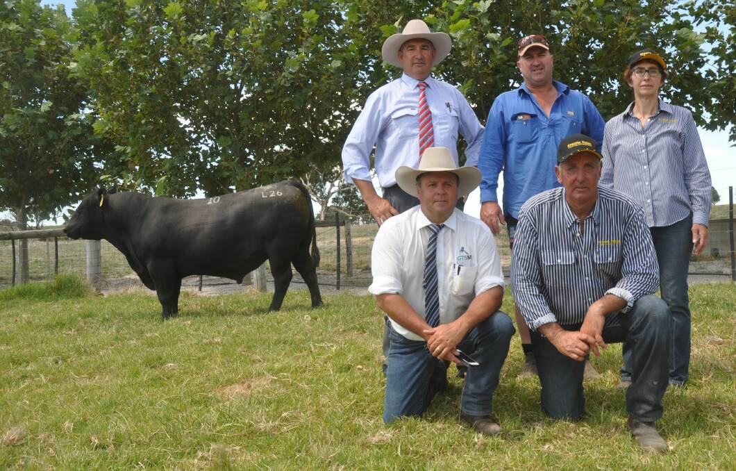 LEGEND BUY: Southern Australian Livestock's Laryn Gogel and top price buyer Greg Fisher, Marcollat with Granite Ridge stud's Pat Ebert and Colin Flanagan and guest auctioneer Michael Glasser (front left).