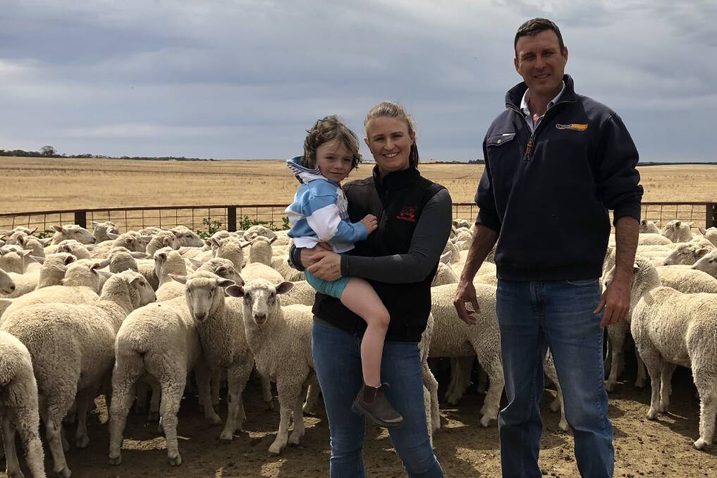 TOP SALE: Kim Thorpe and daughter Ada, McPiggery, Lameroo, with Platinum Livestock agent Adam Bradley, in their top line of 380 Border Leicester-Merino ewe lambs which made $306. Their 1470 head averaged $266.