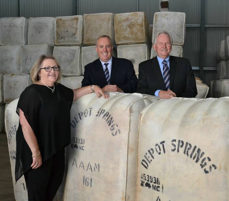 STAFF LOYALTY: Quality Wool managing director Mark Dyson (centre) with wool administration manager Jenny Jenkin and national wool manager Glen Forbes, who have been a driving force behind the company's success.