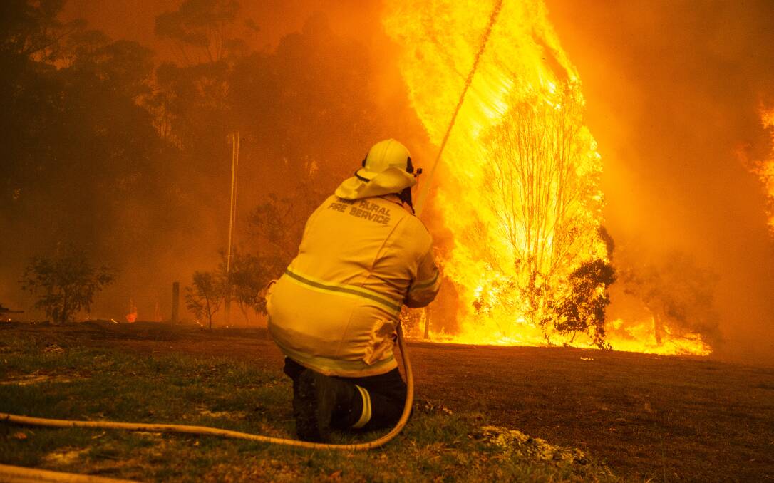 HORRENDOUS: Losses to dairy and beef operations from the bushfires since Christmas have been enormous and another flashpoint is expected this week. Photo: DION GEORGOPOULOS.