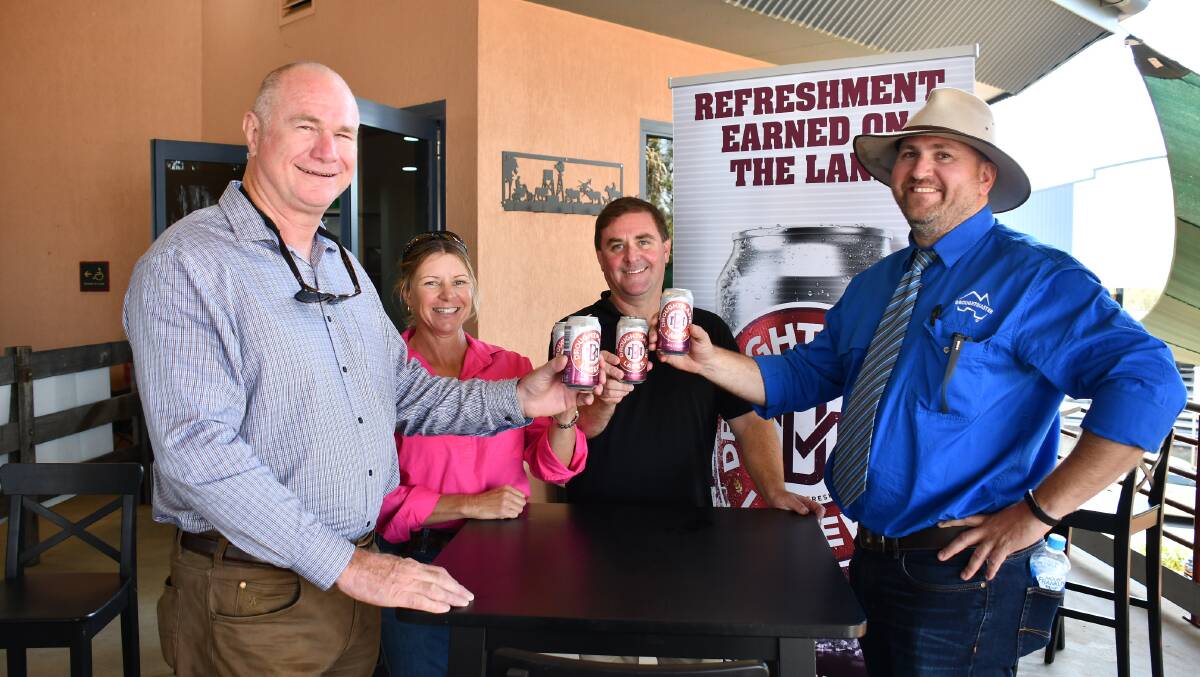 CHEERS: Droughtmaster Lager's Michael Baker and Michael Gubbins with breeder Colleen Smith, Manumbar, and Droughtmaster Society president Todd Heyman, Grafton, at the Droughtmaster National bull sale in Rockhampton this week.