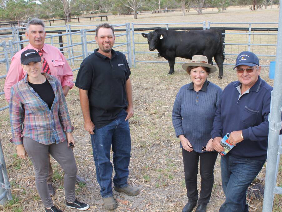 ROYAL LINE: Elders auctioneer Laryn Gogel with Ravenswood principals Anna Crowley and John Gommers and $5000 top price bull buyers Josie and Brian Lord, Stony Well, Meningie. 