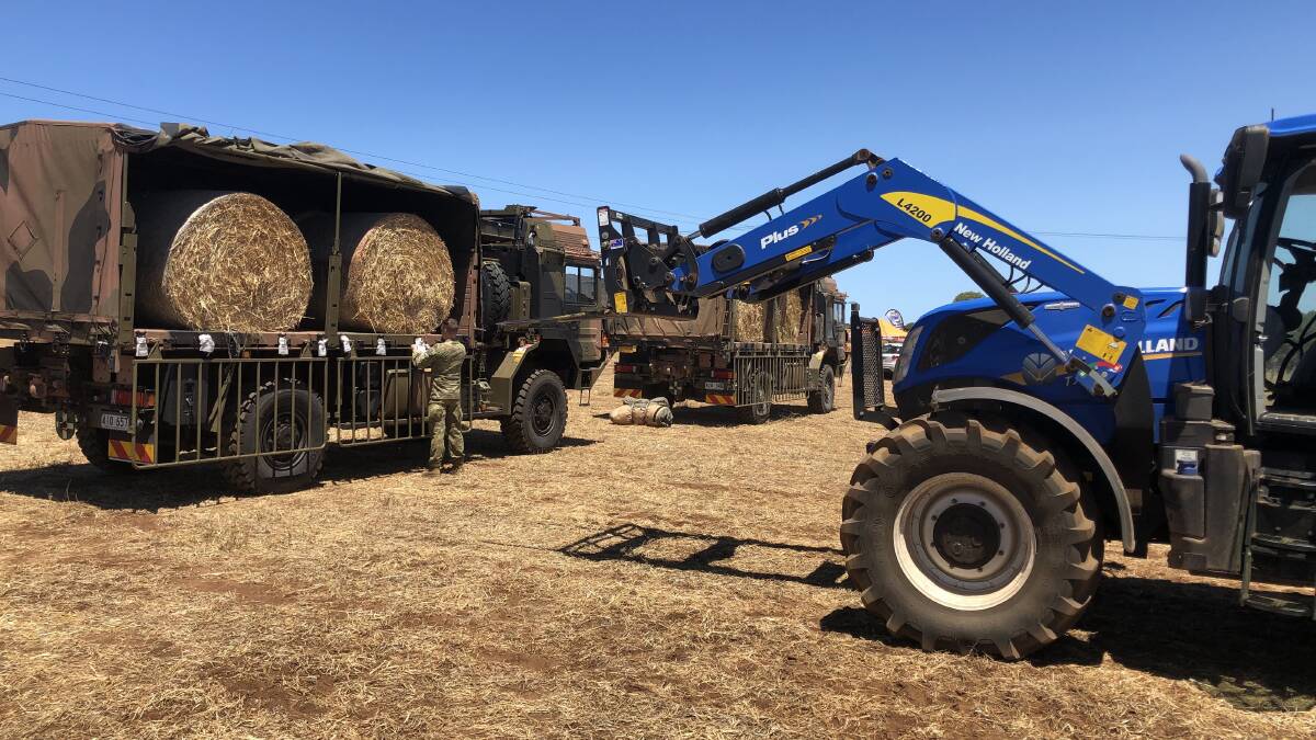LOADS AWAY: The army was on hand to help get loads of hay to Kangaroo Island last week to help fire-affected farmers feed their livestock.