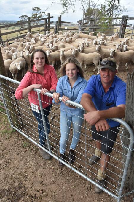 SOUTH BOUND: Simon Formby (right), Strathalbyn, with daughters Stephanie, 16, and Vanessa, 14, and the tops of their first-cross ewe offering bound for Naracoorte. 