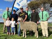 STAND OUT: The Nutrien selling team of Gordon Wood, Simon Aldridge and Richard Miller; stud principal Ric Ridgway (holding cousins Indi Ridgway, 5, and Bridie Ridgway, 5), top price ram buyer Brent Farr and co-principal Matt Ridgway.  