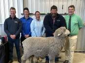 Spence Dix & Co Murray Bridge agent Simon Lehmann, with Ryan and Anne Simcock, Tailem Bend, bought the $5200 top price Woodoona ram from stud principal Nick Wood, Borrika. Also pictured Nutrien Keller Livestock's James McInally.