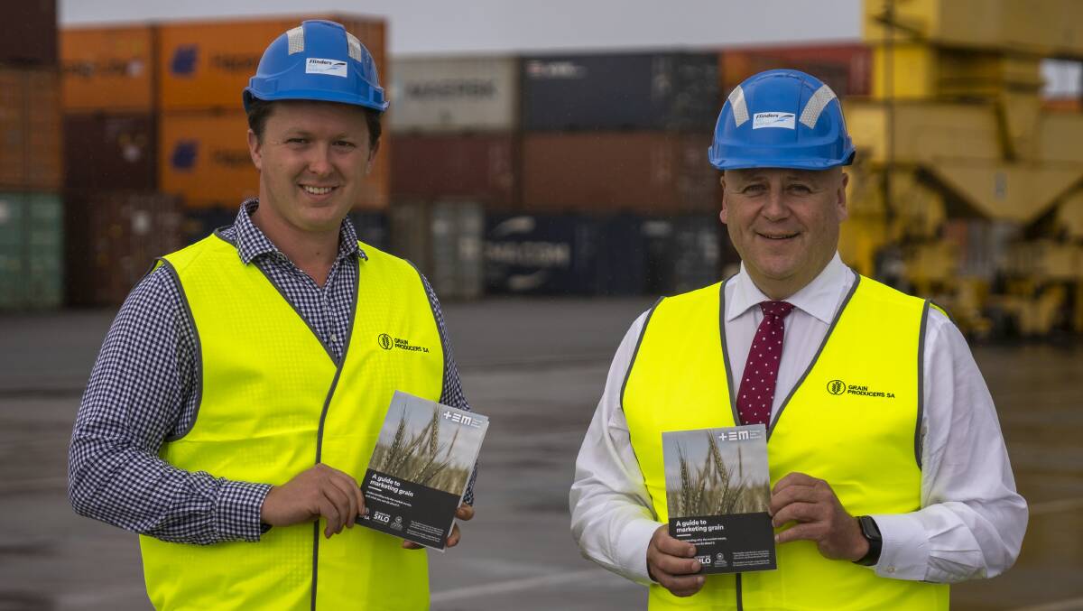 Freeling grower Corbin Schuster and Primary Industries Minister David Basham with the guide at the Flinders Adelaide Container Terminal.