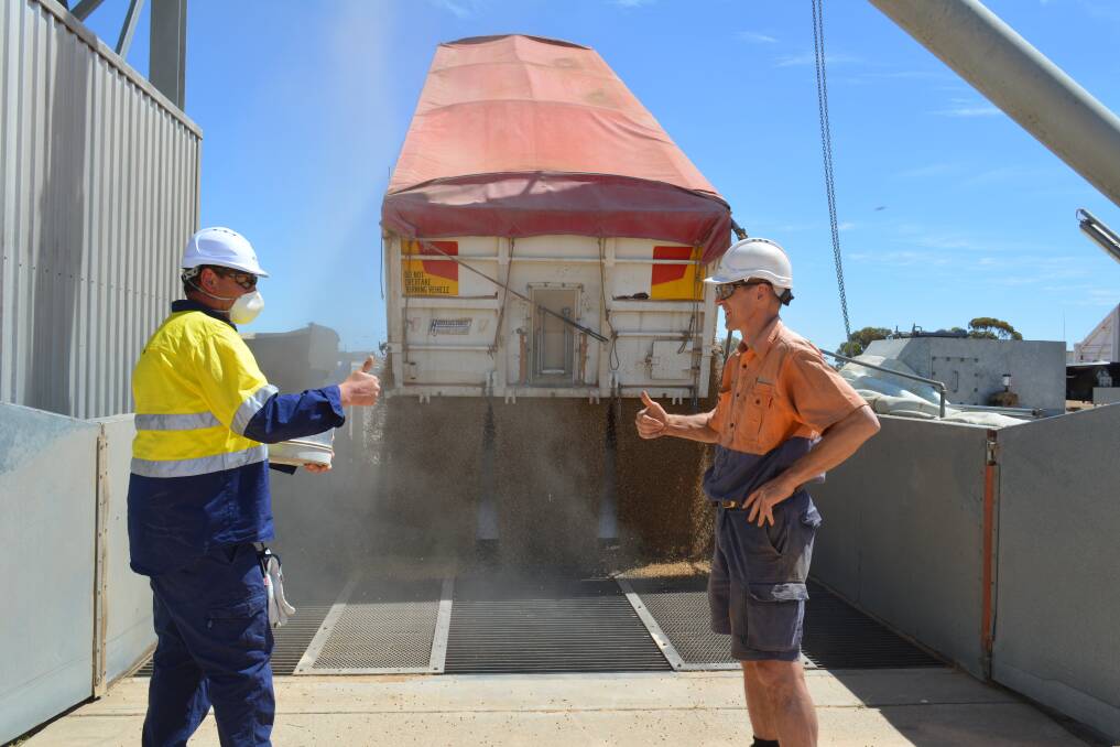 Grower Robin Schaefer of Bulla Burra delivering the first load into Viterra's Loxton site with Viterra employee Chad Thompson.