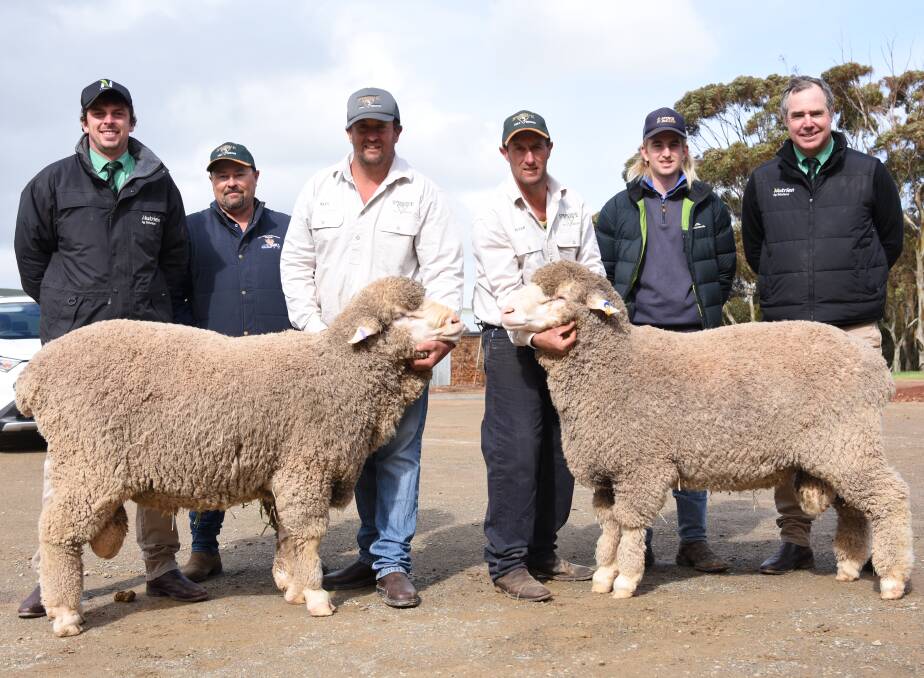 Nutrien's Josh Nourse; top ram buyer Brenton Collins; Springvale North's Alex (with Lot 7) and Peter Stockman (with Lot 2); top ram buyer Tom Treloar; and Nutrien auctioneer Richard Miller. Picture by Chelsea Ashmeade