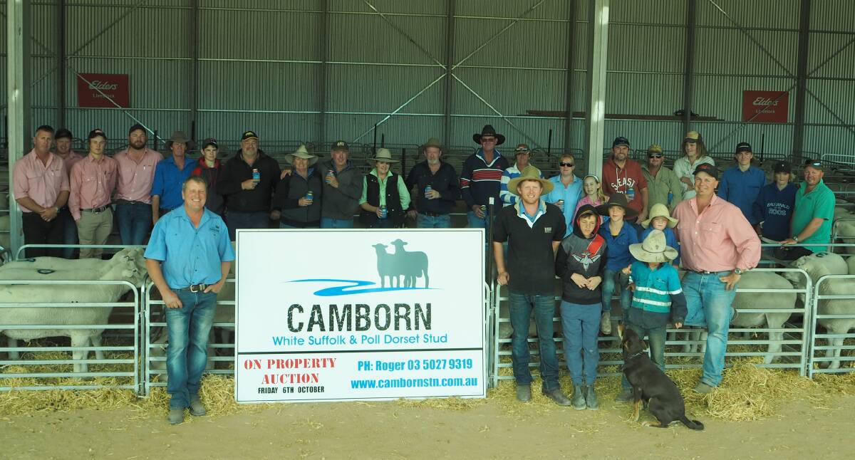 TURN OUT: Camborn principal Roger Wilkinson (front left) with buyers and agents at the stud's annual sale on Friday, where all 281 June/July 2016-drop White Suffolk and Poll Dorset rams offered, sold to $2600.