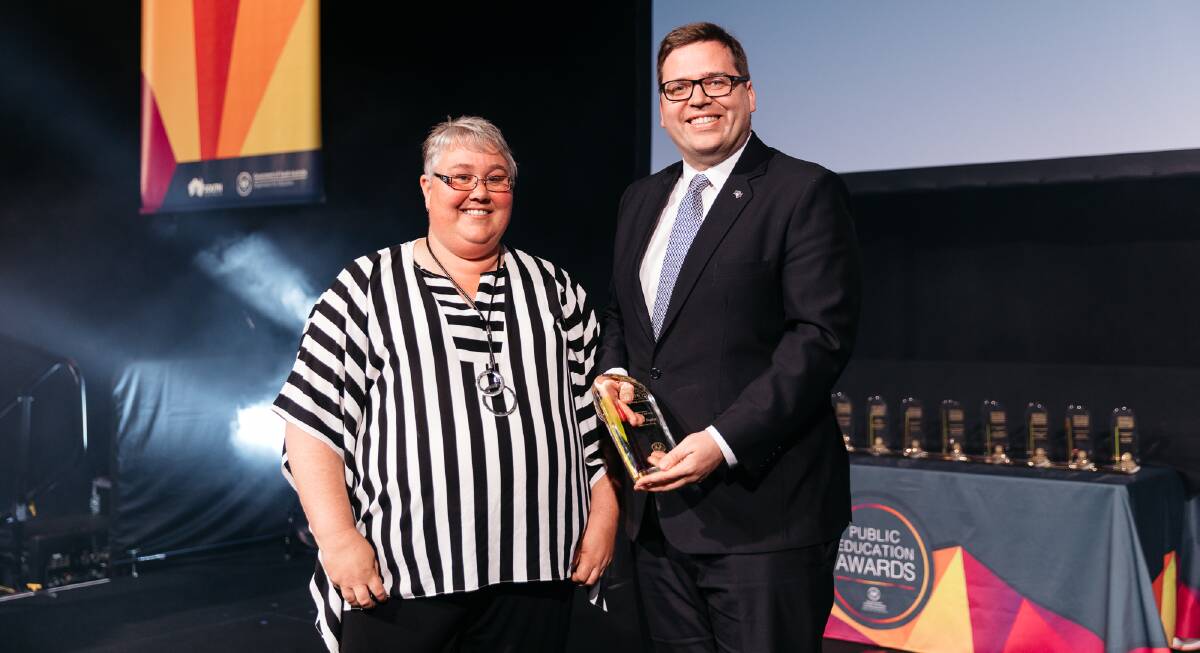 Loxton High School ag teacher Justine Fogden accepting Secondary Teacher of the Year at the SA Public Education Awards recently from Education Minister John Gardner. 