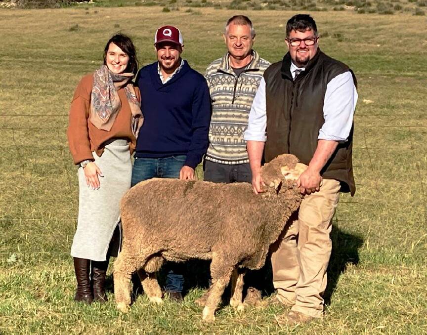 Mel and Dan Hammat, Baderloo Poll Merinos, with top price ram buyer Tony Martin, on behalf of Beegoodyee Farms, and David Whittenbury of Quality Livestock.